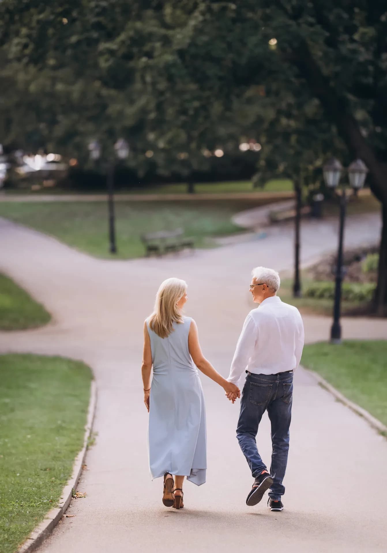 Couple walking together in a park during couples therapy in Riga